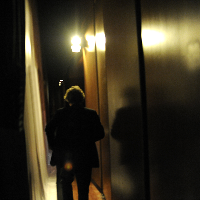 BETWEEN A POSTER AND THE MIRROR